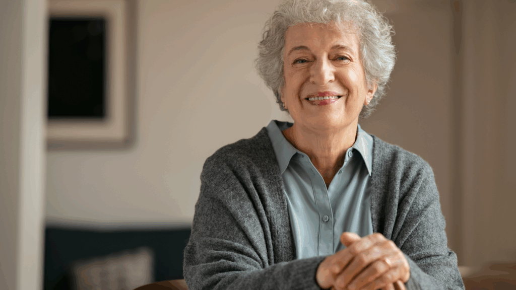 Senior woman sitting down smiling